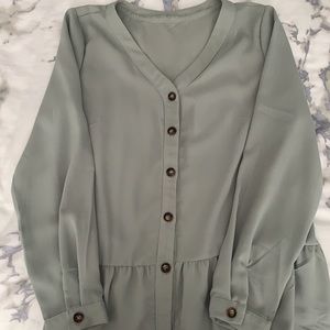 Mint green button down shirt with bottom ruffle